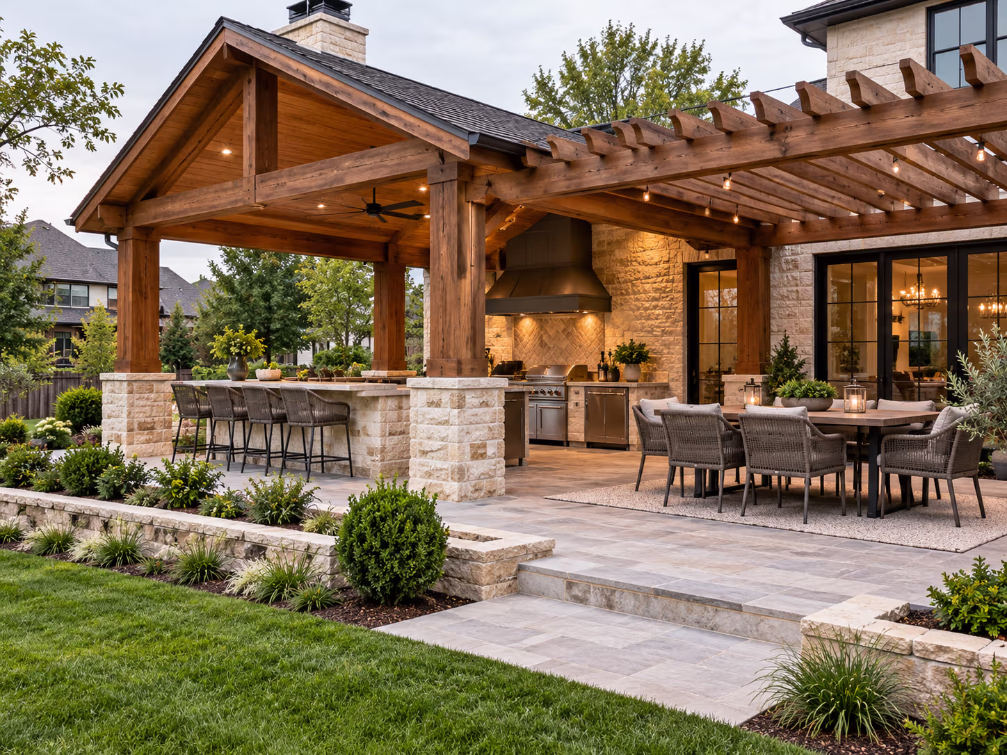 Covered outdoor kitchen with dining and bar seating