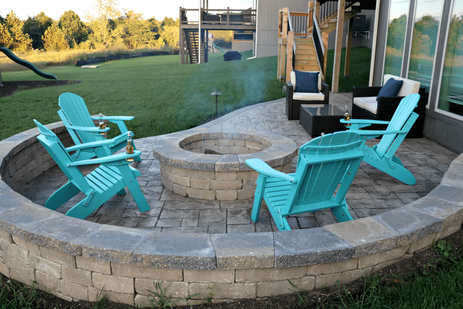fire pit with blue chairs