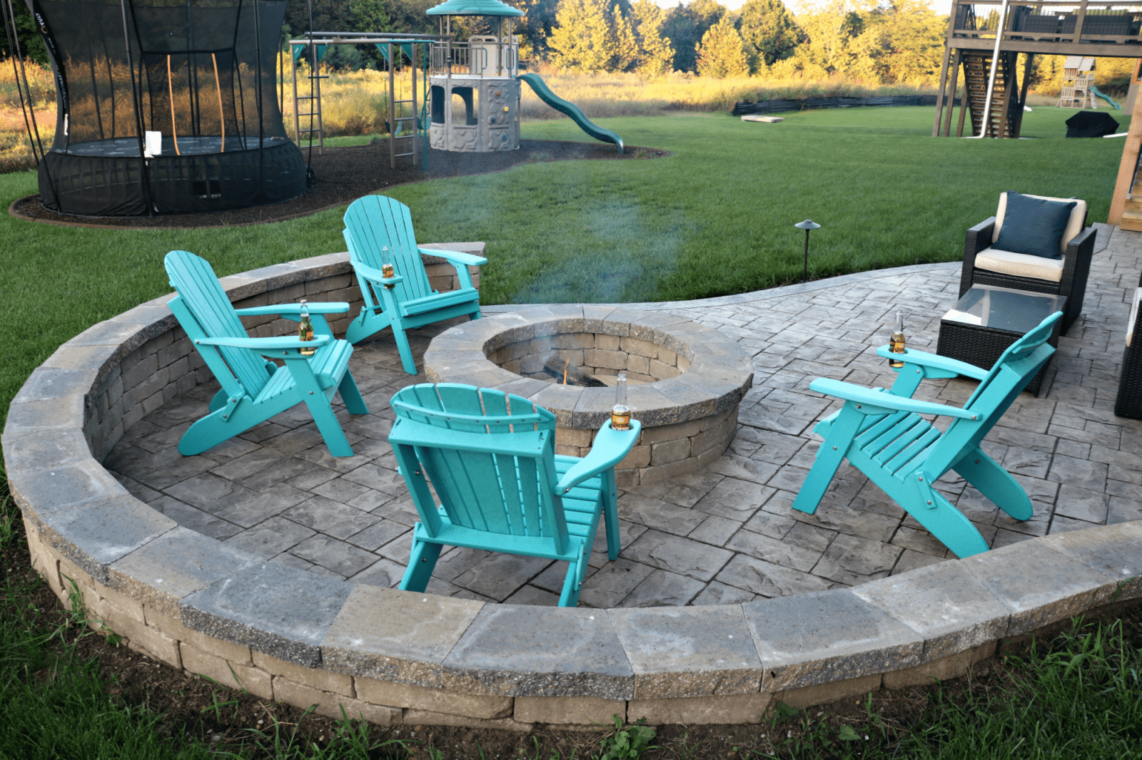 fire pit with blue chairs