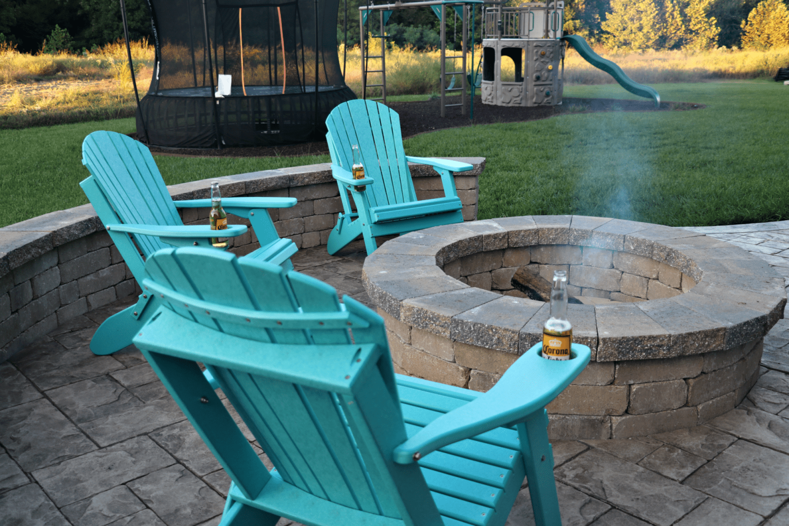 fire pit with blue chairs
