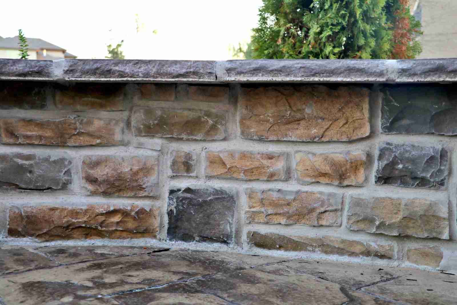 Stone veneer seating wall