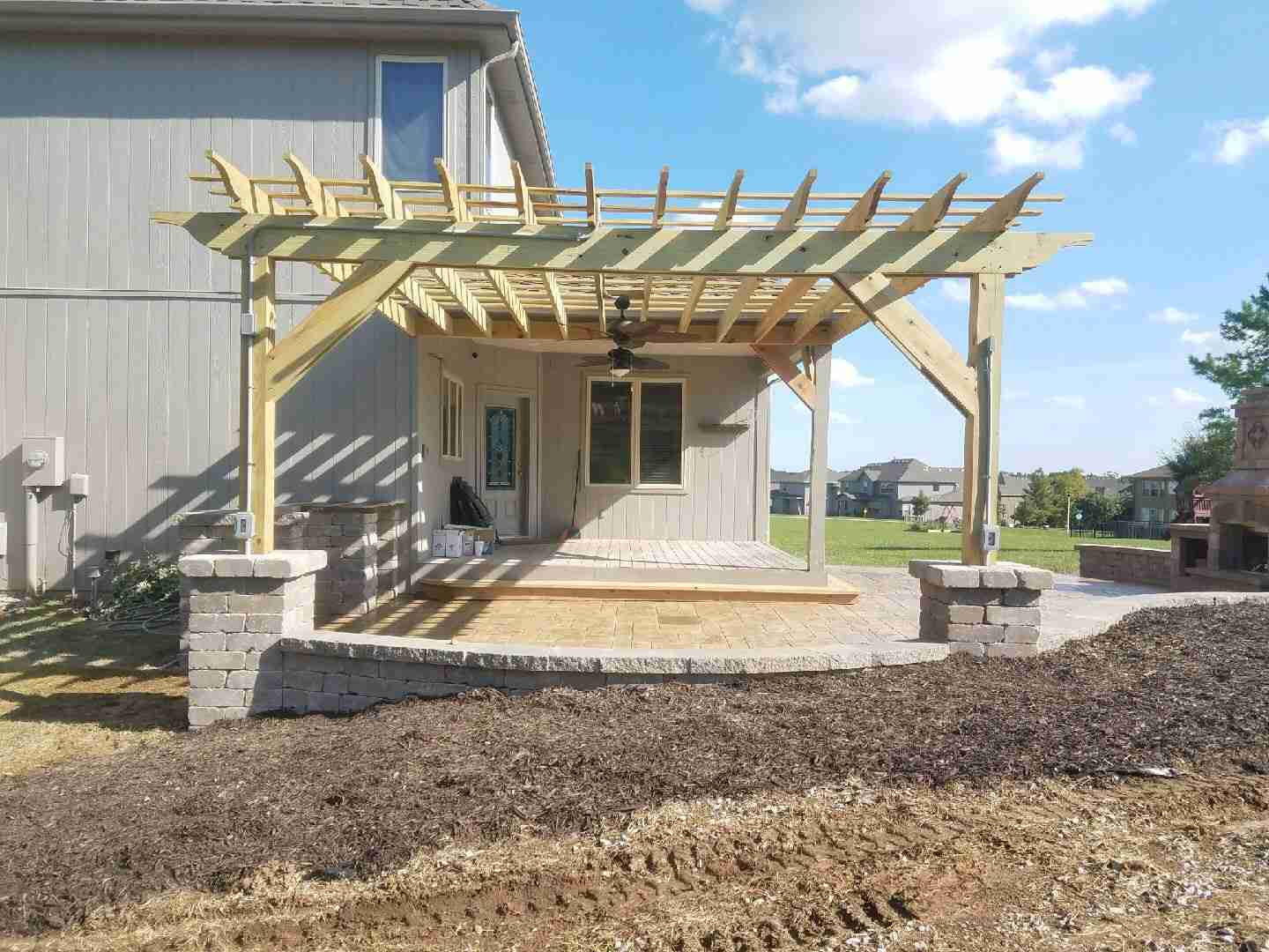 tied the seating wall into the pergola