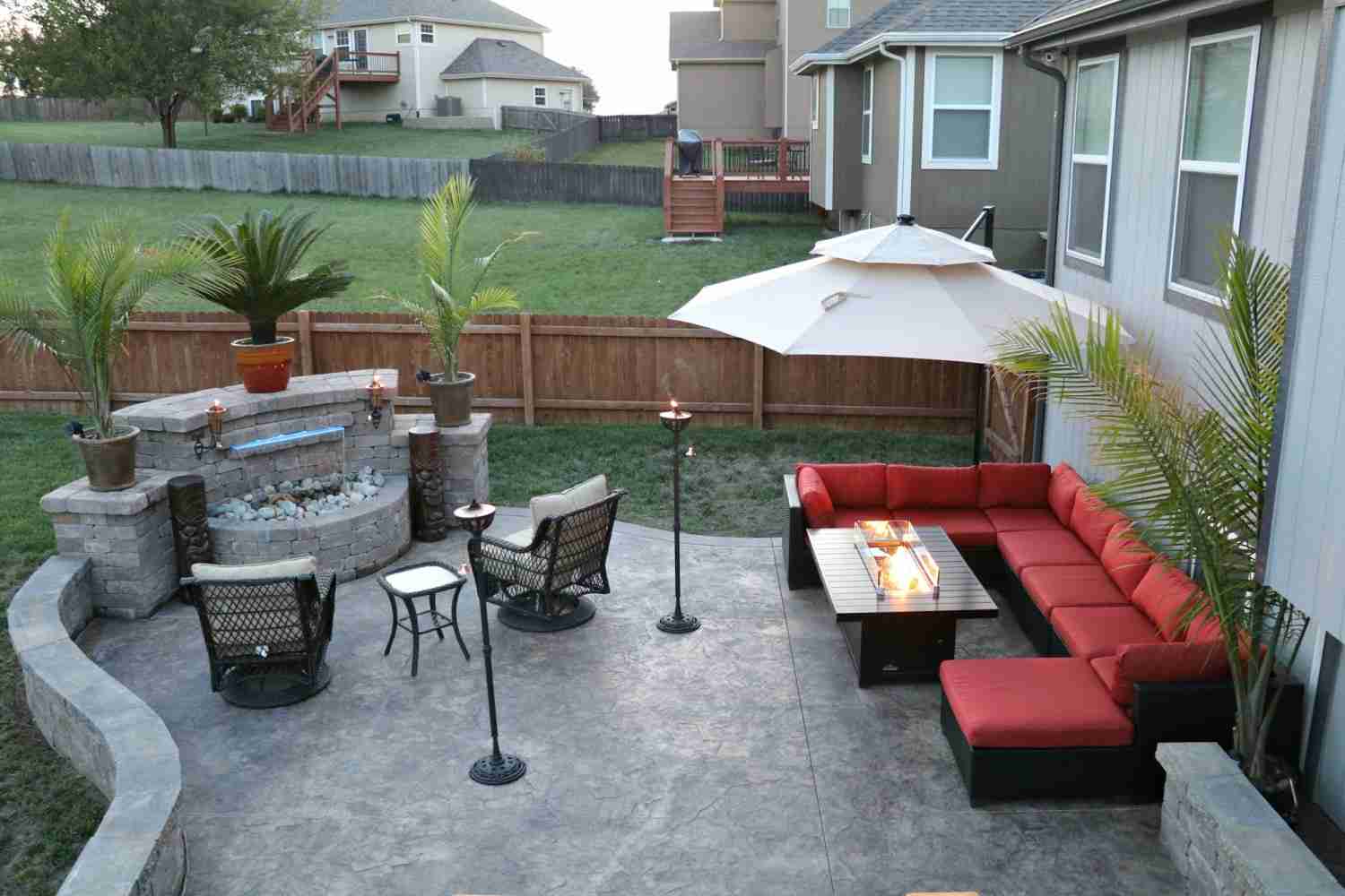 cozy backyard patio with waterfall feature