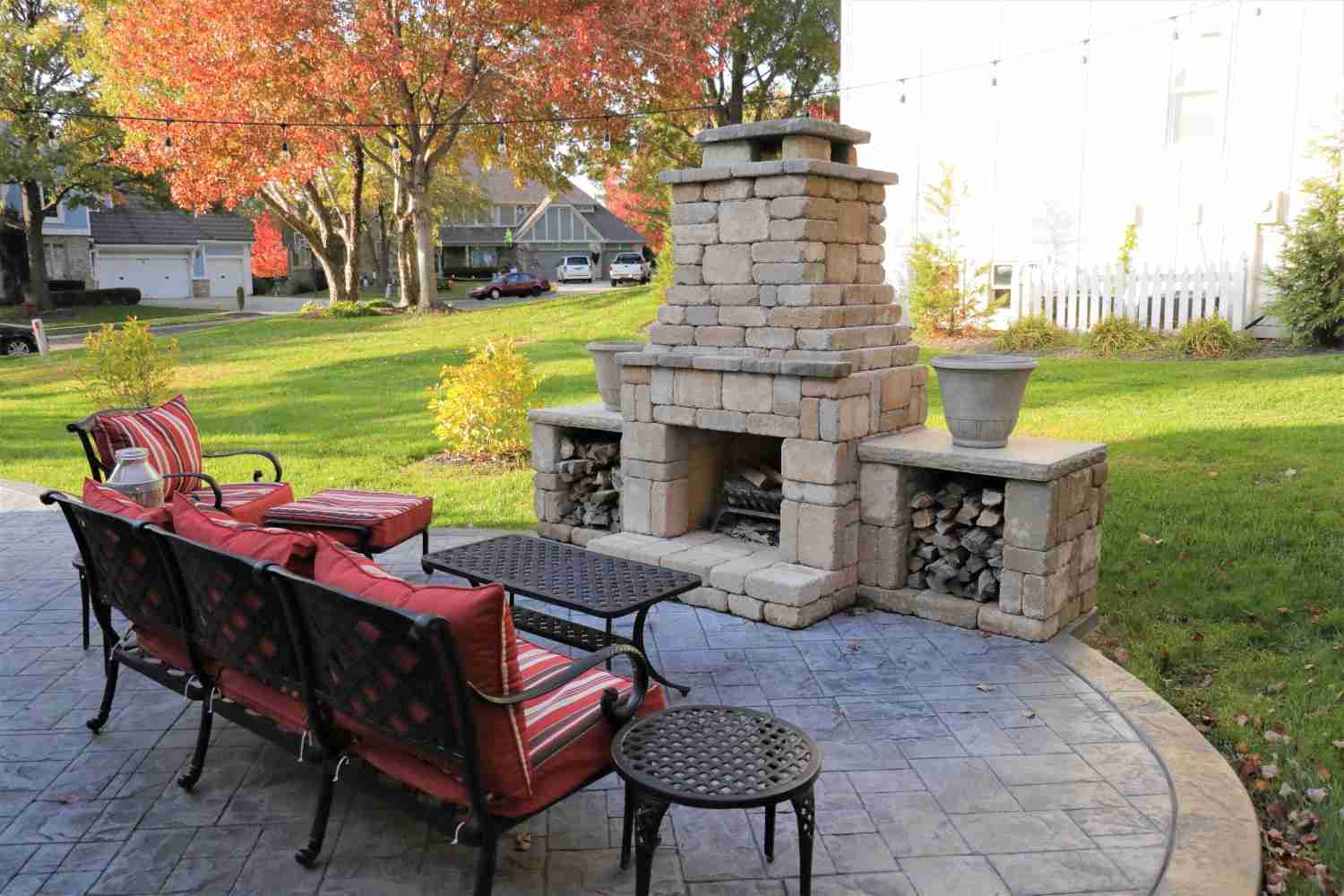 A Patio With A Fireplace & Fire-Pit