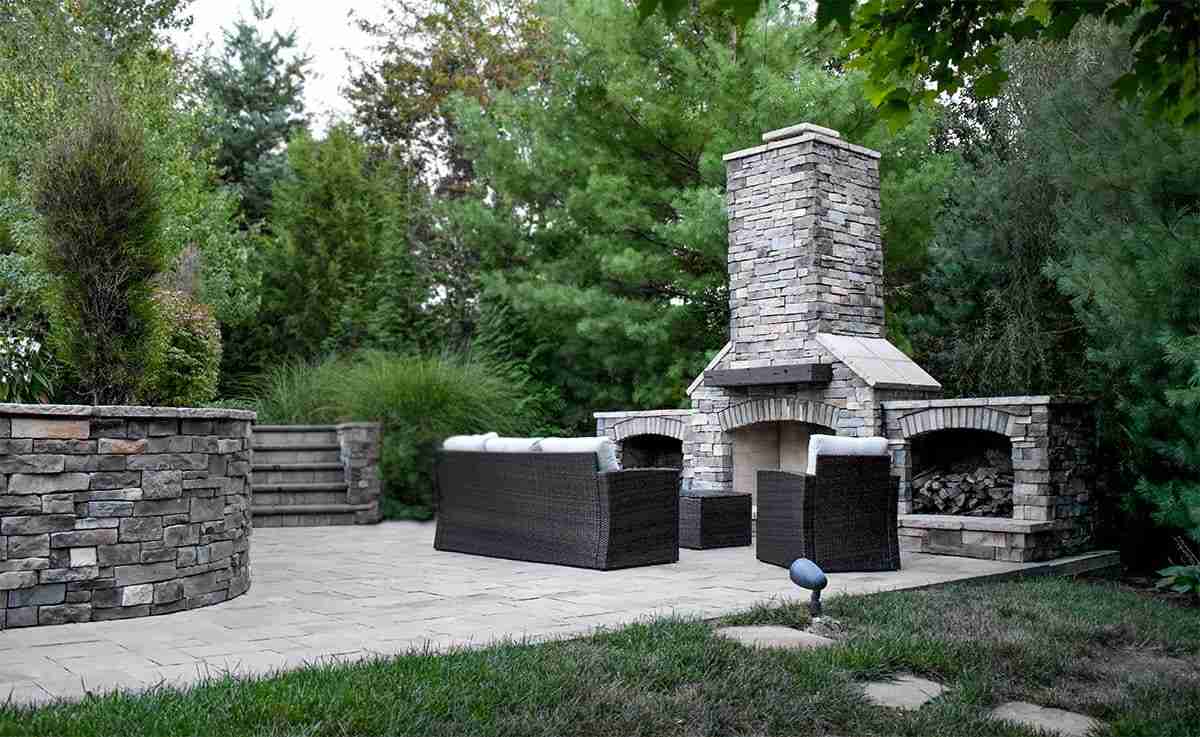Natural stone outdoor fireplace with stone veneer detail